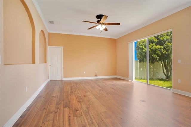 unfurnished room featuring ceiling fan, ornamental molding, and hardwood / wood-style flooring