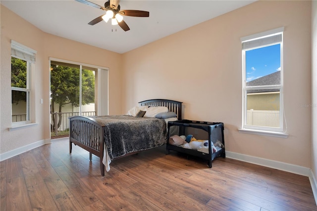 bedroom with ceiling fan and dark hardwood / wood-style floors