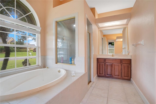 bathroom with vanity, plus walk in shower, and tile patterned floors