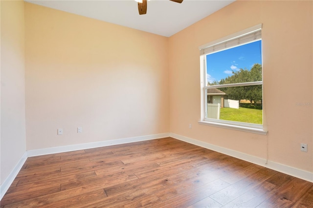 unfurnished room with ceiling fan and wood-type flooring