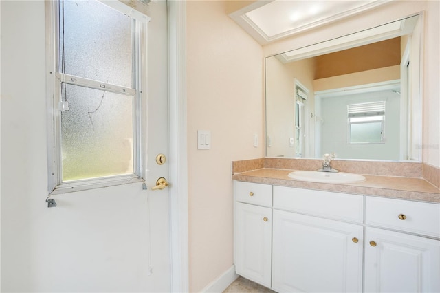 bathroom featuring a wealth of natural light and vanity