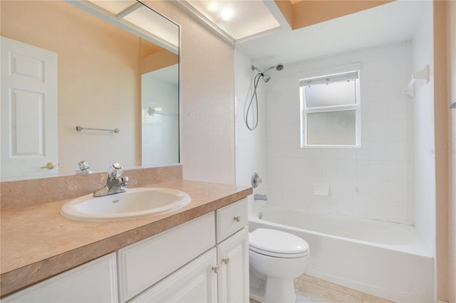 full bathroom with tile patterned flooring, tiled shower / bath, toilet, and vanity