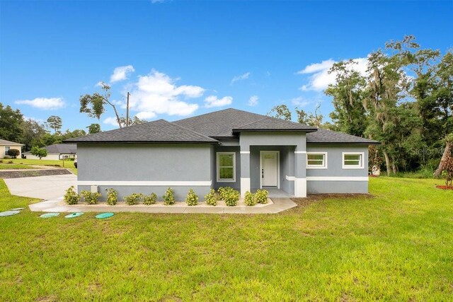 prairie-style home with a front lawn