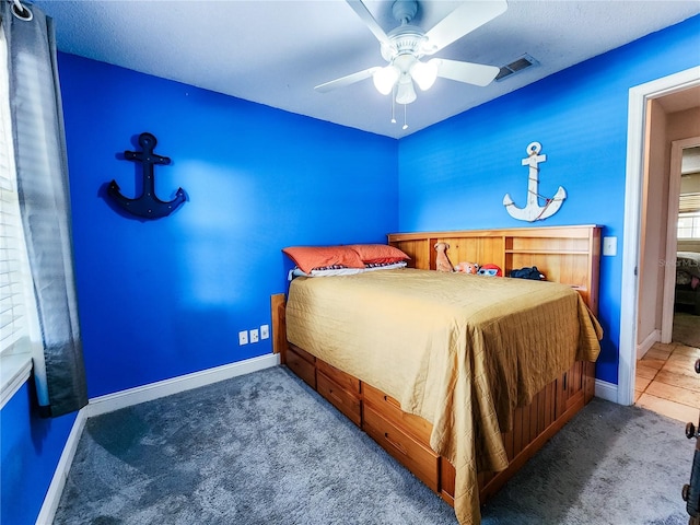 carpeted bedroom featuring ceiling fan