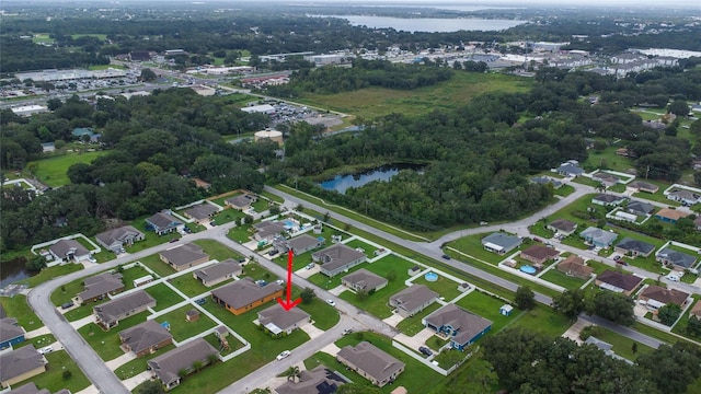 birds eye view of property with a residential view and a water view