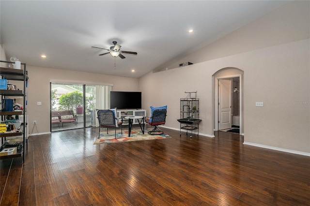 interior space featuring lofted ceiling, ceiling fan, and dark hardwood / wood-style flooring