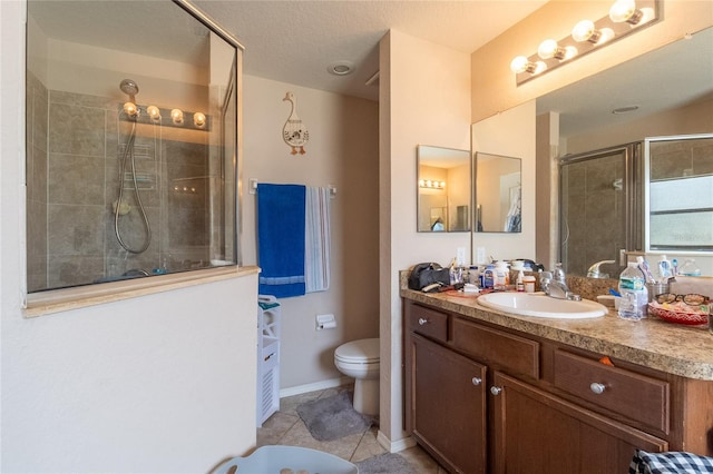 bathroom with tile patterned flooring, an enclosed shower, toilet, vanity, and a textured ceiling