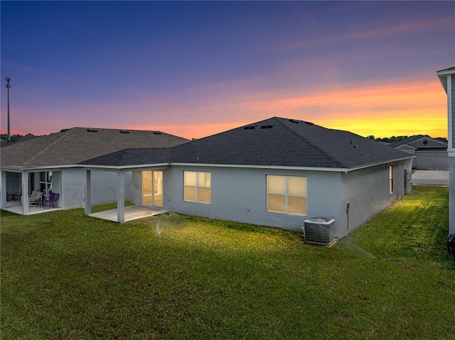 1029 Mattie Pointe Way, Auburndale, FL 33823 - back of house with a patio, central air condition unit, roof with shingles, and stucco siding