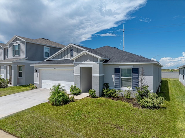 1029 Mattie Pointe Way, Auburndale, FL 33823 - view of front of house featuring concrete driveway, an attached garage, board and batten siding, a front yard, and a shingled roof