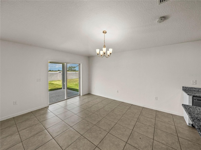 1029 Mattie Pointe Way, Auburndale, FL 33823 - spare room with baseboards, a textured ceiling, tile patterned flooring, and a notable chandelier