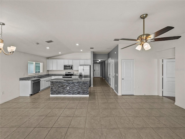 1029 Mattie Pointe Way, Auburndale, FL 33823 - kitchen with white cabinets, visible vents, appliances with stainless steel finishes, a sink, and vaulted ceiling