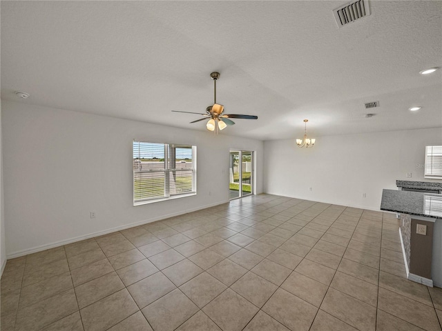 1029 Mattie Pointe Way, Auburndale, FL 33823 - unfurnished living room featuring recessed lighting, ceiling fan with notable chandelier, a textured ceiling, light tile patterned flooring, and visible vents