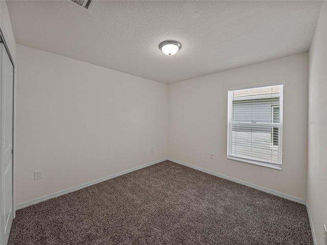 1029 Mattie Pointe Way, Auburndale, FL 33823 - unfurnished room featuring carpet floors, baseboards, visible vents, and a textured ceiling