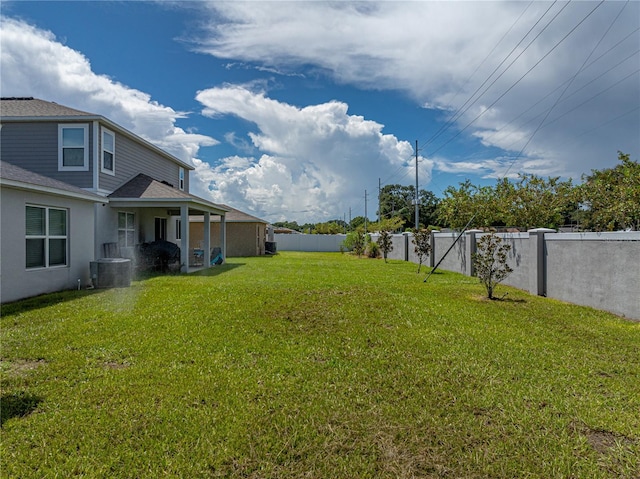 1029 Mattie Pointe Way, Auburndale, FL 33823 - view of yard featuring a fenced backyard and central AC unit