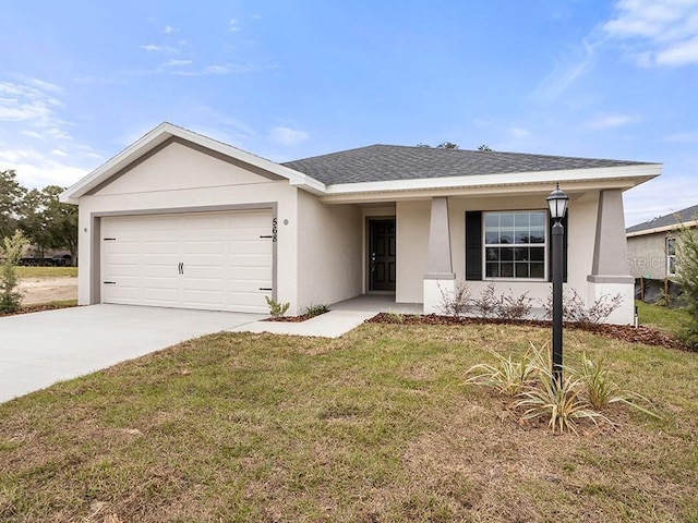 ranch-style house with driveway, an attached garage, a front yard, roof with shingles, and stucco siding