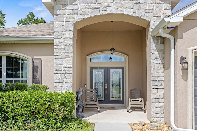 view of exterior entry featuring french doors