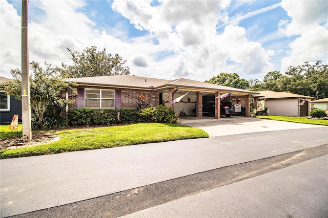 ranch-style home with a carport and a front lawn