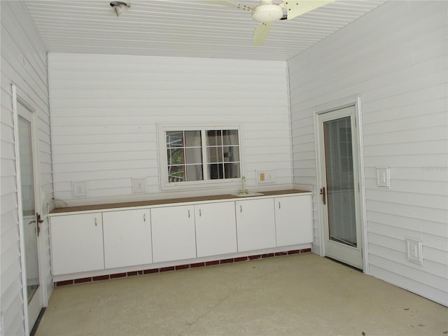 interior space featuring a ceiling fan