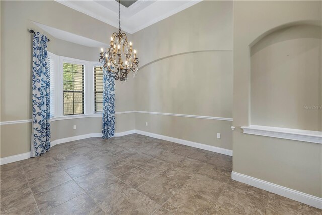 unfurnished room with a notable chandelier and ornamental molding