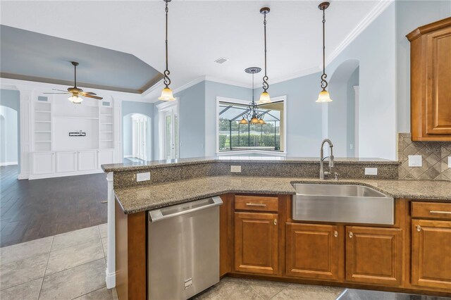 kitchen featuring dishwasher, stone counters, ceiling fan, light hardwood / wood-style flooring, and sink