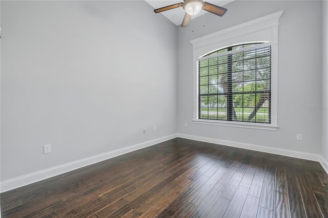 unfurnished room with ceiling fan, vaulted ceiling, and dark hardwood / wood-style flooring