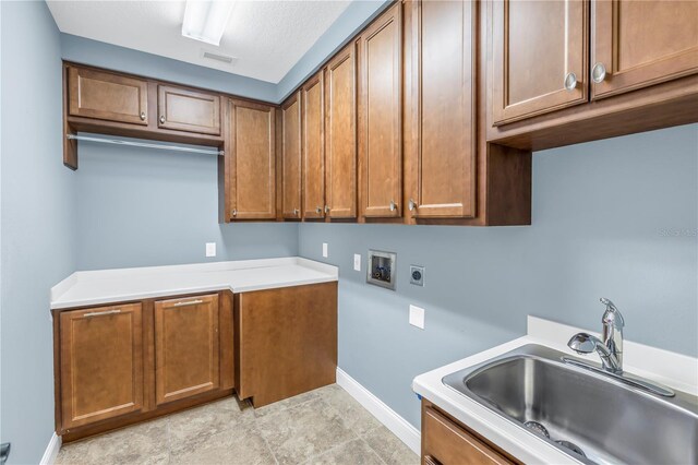 washroom featuring washer hookup, hookup for an electric dryer, cabinets, and sink