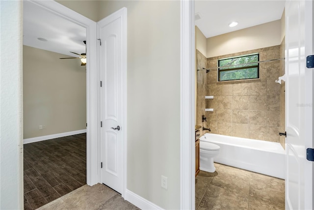 bathroom with toilet, hardwood / wood-style floors, ceiling fan, and tiled shower / bath