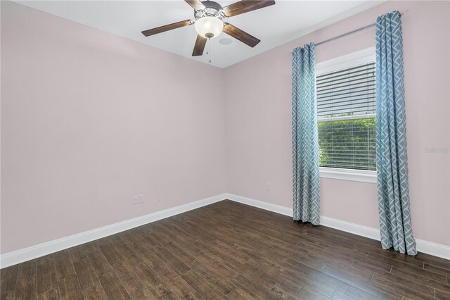 empty room featuring dark hardwood / wood-style floors and ceiling fan