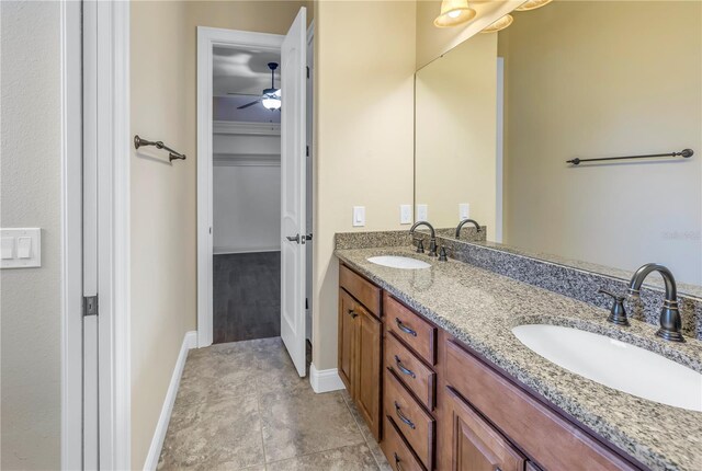 bathroom featuring ceiling fan and vanity