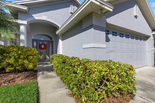 doorway to property featuring a garage