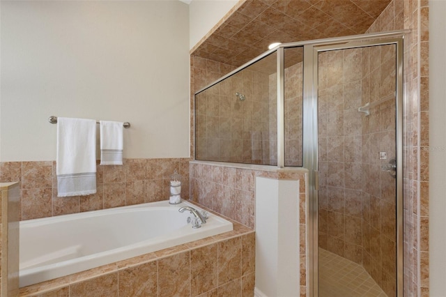 bathroom featuring plus walk in shower