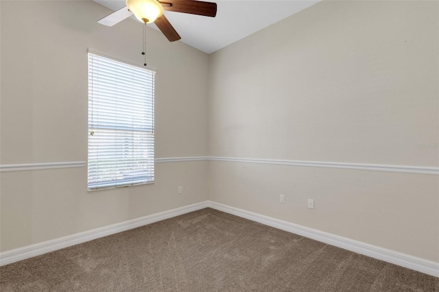 carpeted empty room with ceiling fan, lofted ceiling, and a healthy amount of sunlight