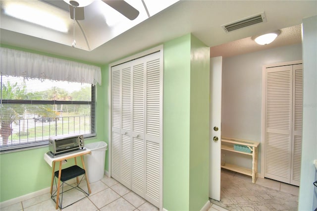 tiled office with ceiling fan