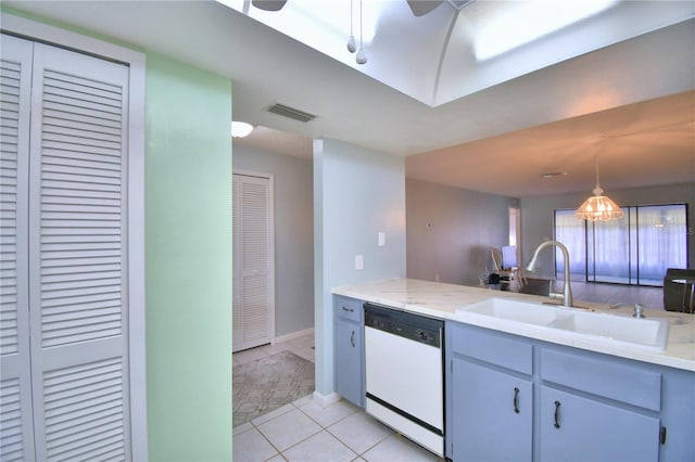 kitchen featuring light tile patterned flooring, sink, hanging light fixtures, white dishwasher, and ceiling fan