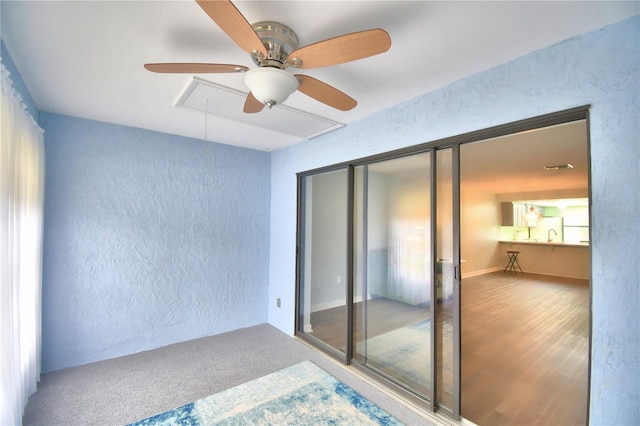 bedroom with ceiling fan, a closet, and carpet flooring