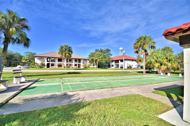 view of community featuring a yard