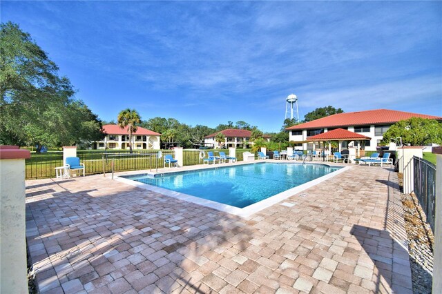 view of pool featuring a patio area