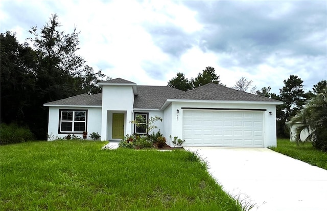 ranch-style house featuring a front yard and a garage