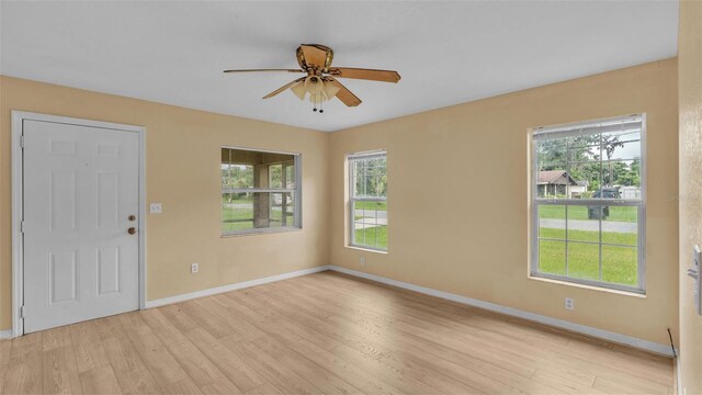 interior space with plenty of natural light, light hardwood / wood-style flooring, and ceiling fan