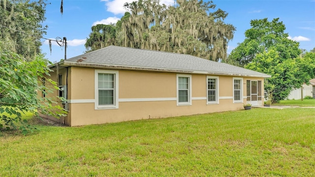 view of property exterior featuring a lawn