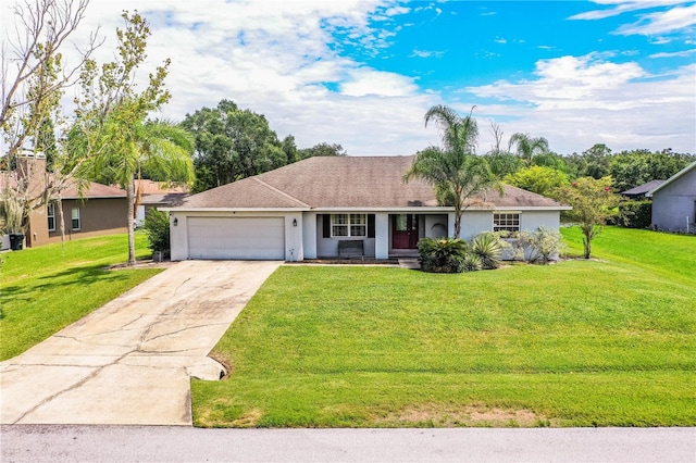 ranch-style home featuring a front lawn and a garage