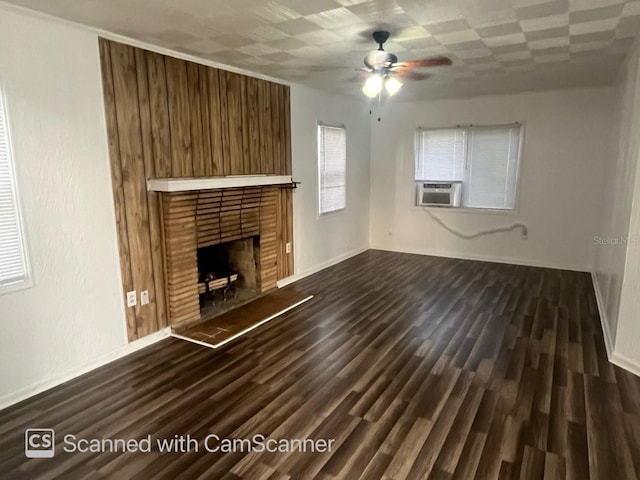 unfurnished living room featuring dark wood-type flooring, ceiling fan, and a fireplace