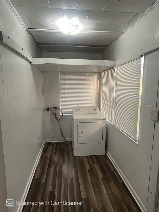 laundry area with dark hardwood / wood-style flooring and washer / clothes dryer