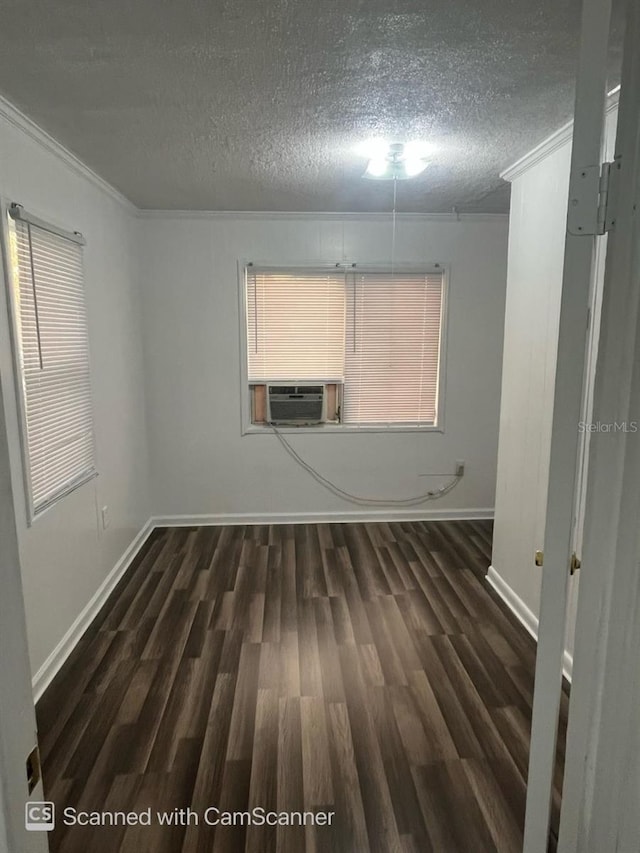 unfurnished room featuring crown molding, dark hardwood / wood-style flooring, and a textured ceiling