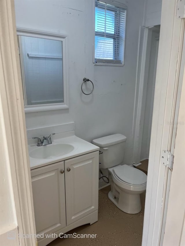 bathroom featuring vanity and toilet