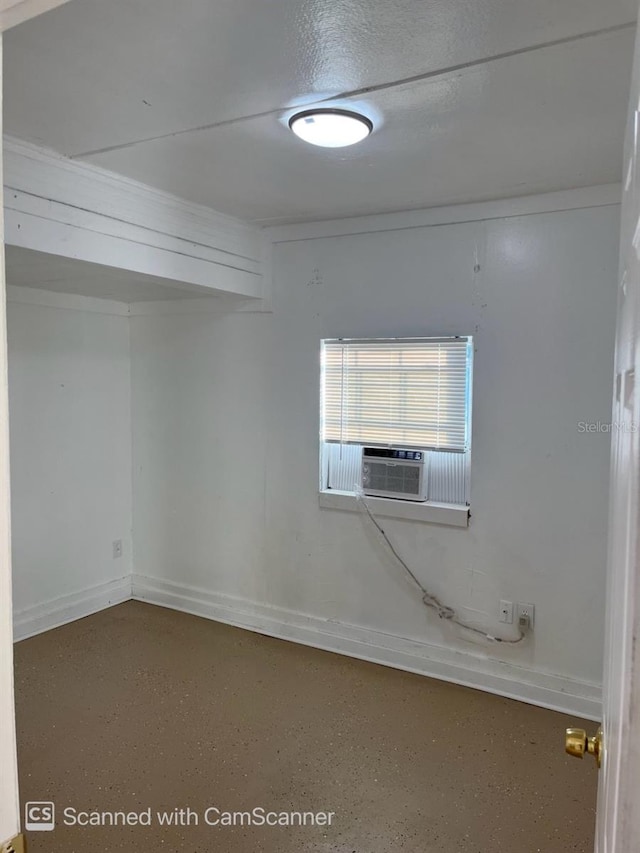 unfurnished room featuring cooling unit