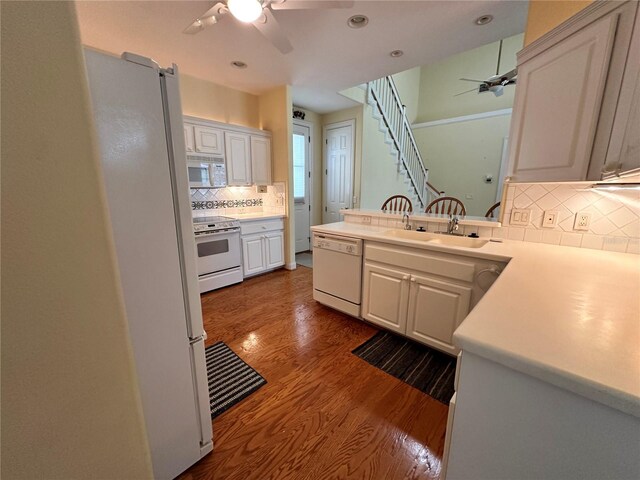 kitchen featuring ceiling fan, white cabinetry, white appliances, and decorative backsplash