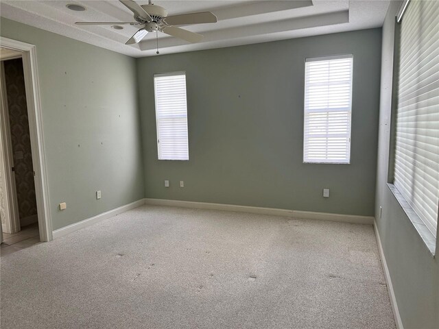 carpeted empty room with ceiling fan