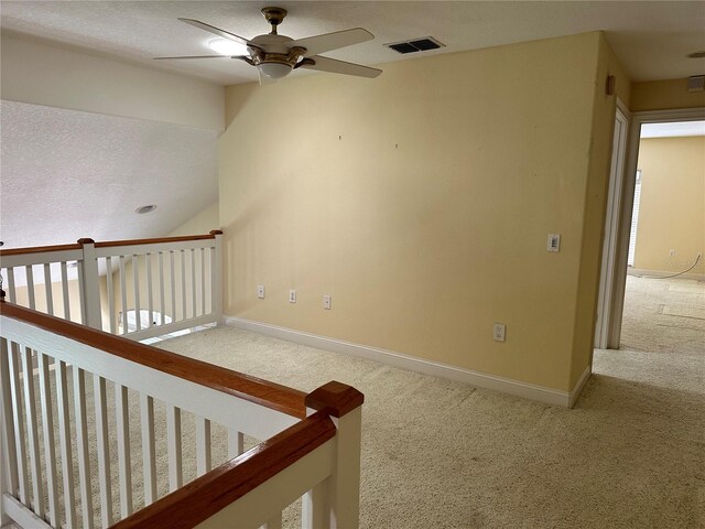 interior space featuring ceiling fan and a textured ceiling