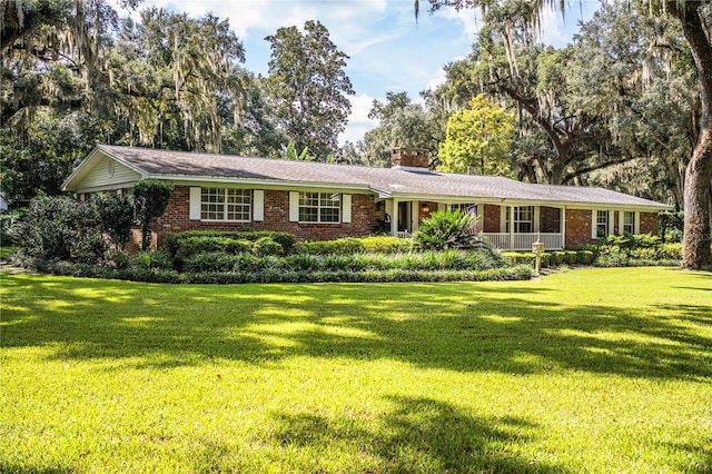 ranch-style home with a front yard